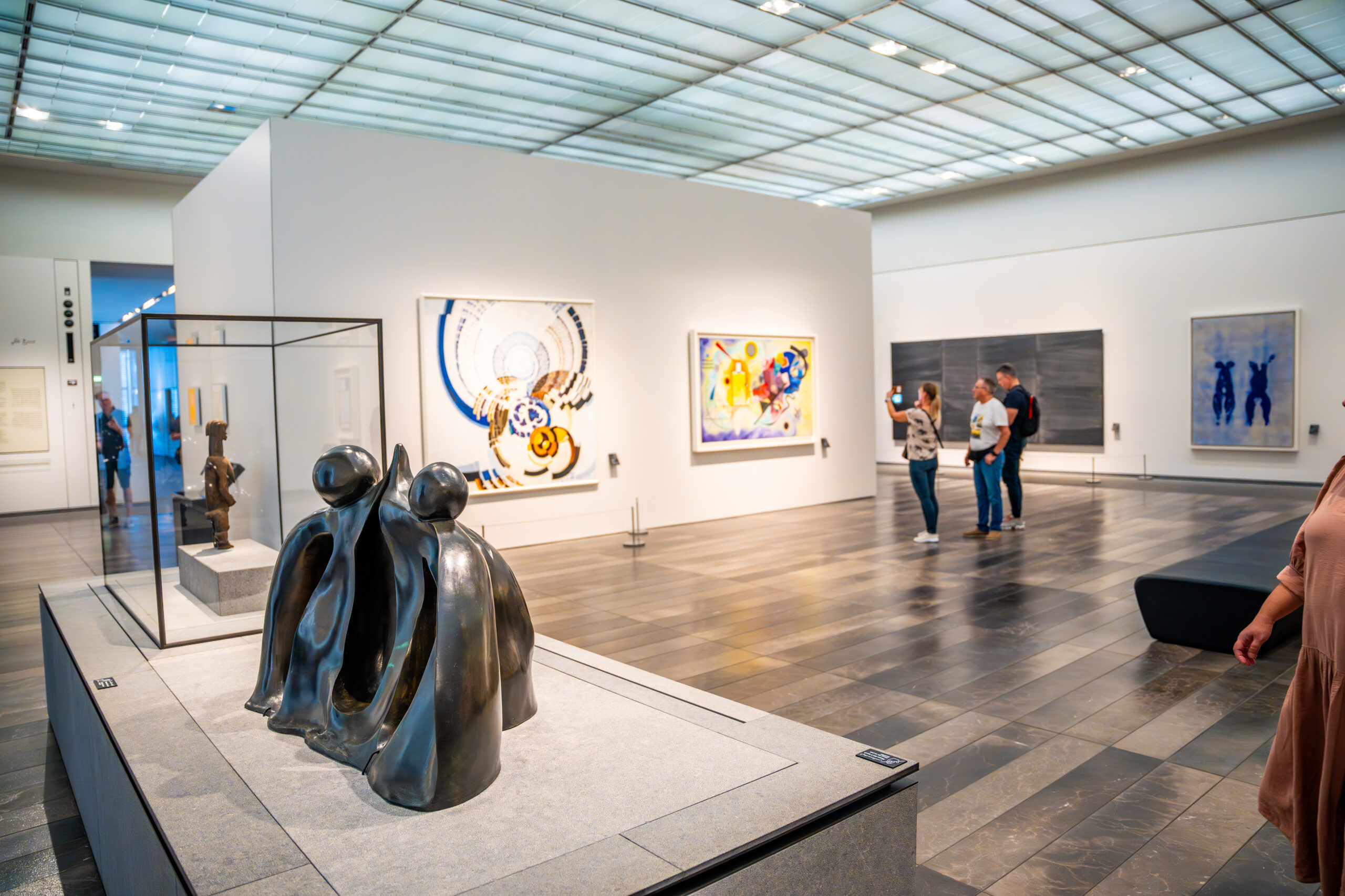 Abu Dhabi, UAE - December 6, 2023: Interior of Louvre and Visitors looking at exhibits, museum in Abu Dhabi, UAE